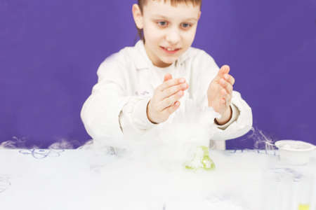 boy study science education in the class. Chemical laboratory with test tubes for experiments and...