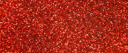 glittering background of a red sequins closeup. Sparkle festive texture. bannerの写真素材