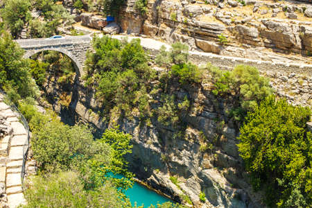 Ancient Roman bridge over the Koprucay river gorge in Koprulu national Park in Turkey.の写真素材