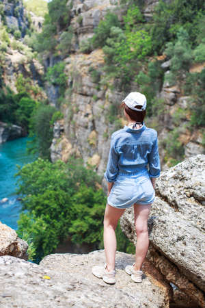 landscape in Manavgat Turkey. happy girl on the steep slope. valley and cliff. Koprulu national Park.の写真素材