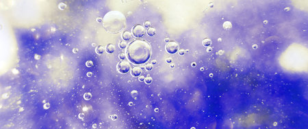Oil bubbles close up. a circles of water macro. abstract light blue background. bannerの写真素材