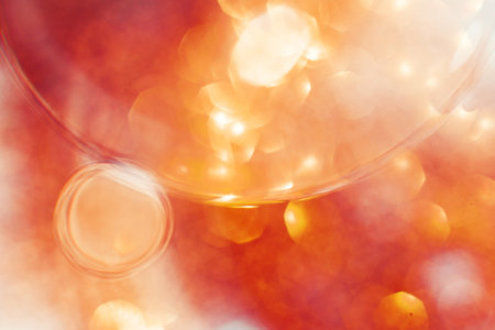 Oil bubbles close up. a circles of water macro. abstract orange and fiery red backgroundの写真素材