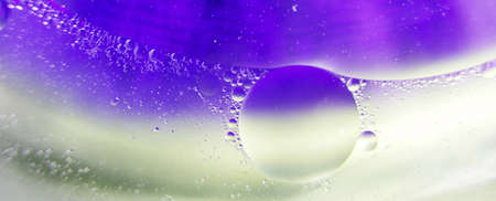 Oil bubbles close up. circles of water macro. abstract light blue background. bannerの写真素材