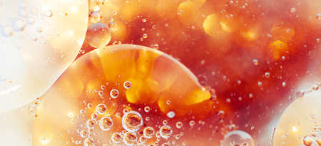 Oil bubbles close up. circles of water macro. abstract orange and fiery red background. bannerの写真素材