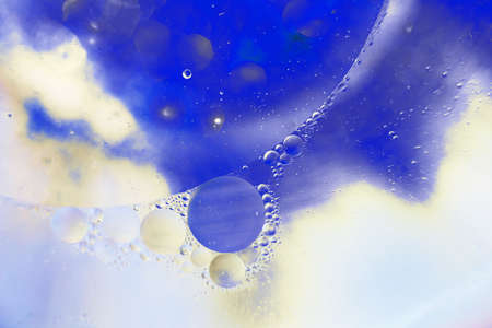 Oil bubbles close up. circles of water macro. abstract light blue backgroundの写真素材