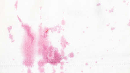dirty stains on clothes from berries on a white background close.の写真素材