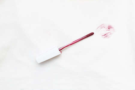 red lipstick on a white clothes with dirty stain from kiss.の写真素材