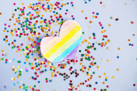 milticolored sequins and lgtb flag in the form of a heart. concept of a lgbt holiday.の写真素材