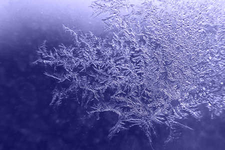 snow pattern on the glass from frost. Very Peri color of the year.の写真素材