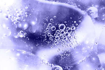 Oil bubbles close. circles of water macro. abstract light blue background. Very Peri color of year.の写真素材
