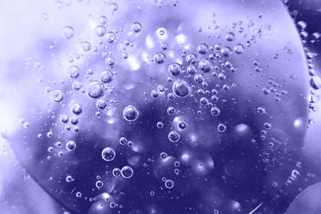 Oil bubbles close. circles of water macro. abstract light blue background. Very Peri color of year.の写真素材