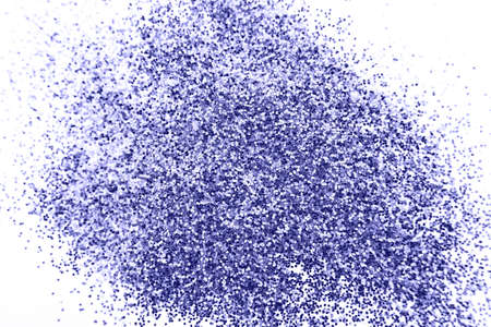 glittering background of a purple sequins isolated on a white background closeup. Sparkle festive textureの写真素材