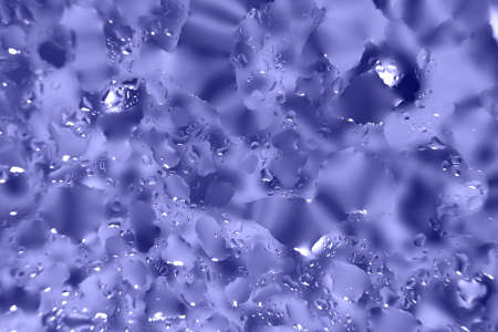 water drops on a purple background. Abstract background. Water drops on glassの写真素材