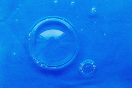 soap bubble close up. abstract blue water backgroundの写真素材