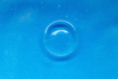 soap bubble close up. abstract blue water backgroundの写真素材