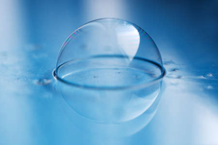 soap bubble close up. abstract blue water backgroundの写真素材