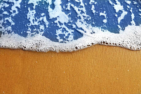 Soft sea wave with foam on sand beach, text space. sea landscape backgroundの写真素材