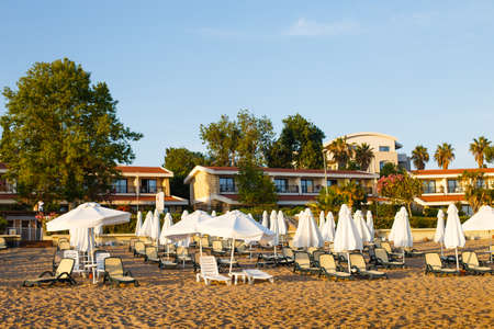 beach scene in Side Turkey with empty umbrellas and sun loungers. Vacation at the sea. Summer holidays.の写真素材
