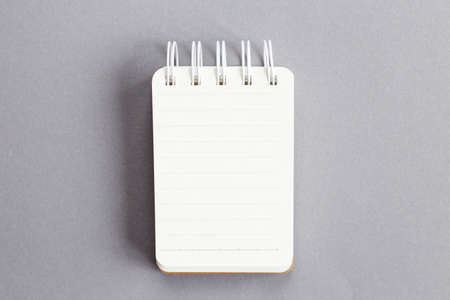 Top view of empty blank note paper on gray backgroundの写真素材