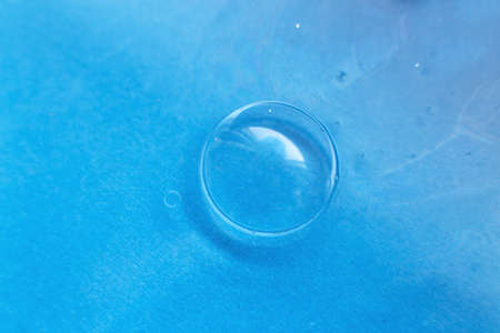 soap bubble close up. abstract blue background.の写真素材