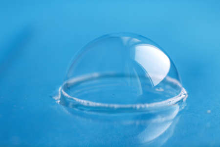 soap bubble close up. abstract blue background.の写真素材
