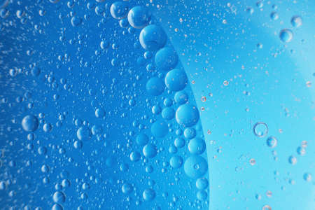 abstract light blue background with oil circles . bubbles of water close up .の写真素材