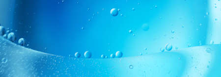 abstract light blue background with oil circles . bubbles of water close up . bannerの写真素材