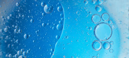 abstract light blue background with oil circles . bubbles of water close up . bannerの写真素材