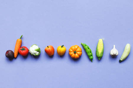 many vegetables and fruits on purple background. healthy food concept.の写真素材