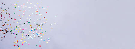 multicolor sparkles on purple background. Festive backdrop for your projects. banner