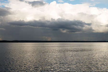 beautiful blue lake landscape with clouds in the sky.