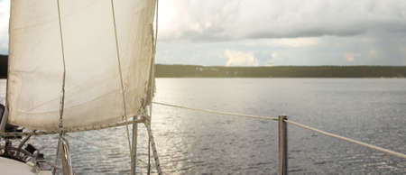 sail of a yacht sailing on the lake.
