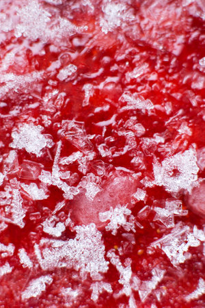 Mashed red fresh frozen strawberries background closeup.の写真素材