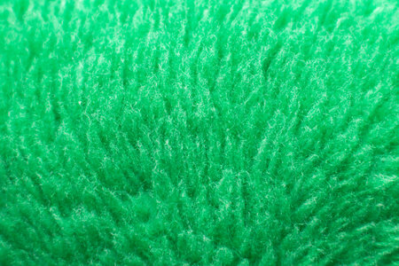 Green fluffy textile texture. Nappy hairy background closeupの写真素材