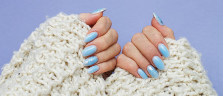 Cozy nails with winter manicure with snowflakes.の写真素材
