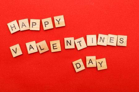 inscription happy Valentine's day with hearts on a red backgroundの写真素材
