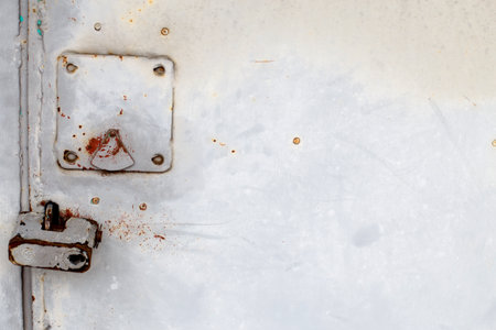 lock on an old metal rusty door. abstract background. Texture of an old blue grunge metal plate with cracked paint. Rusted painted wall.の写真素材