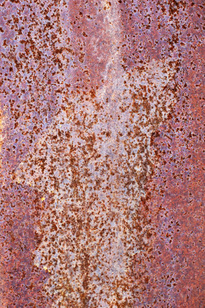 Paint rusty metal brown plate background. Texture of an old grunge metal plate with cracked paint. Rusted white dark painted wall.の写真素材