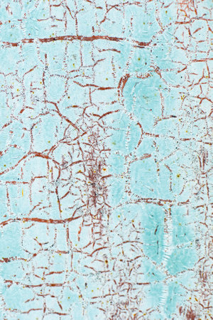 Rusty turquoise metal abstract background. Texture of an old blue grunge metal plate with cracked paint. Rusted white and browm painted wall.の写真素材