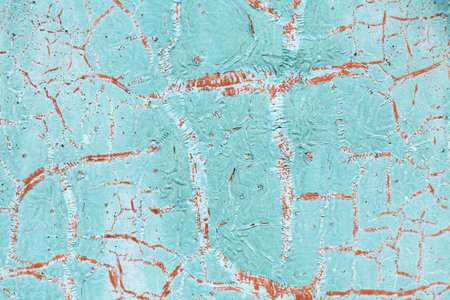 Rusty turquoise metal abstract background. Texture of an old blue grunge metal plate with cracked paint. Rusted white and browm painted wall.の写真素材