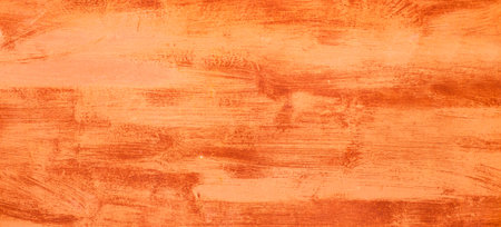 Orange fiery abstract painted metal plate texture and background. Texture of an old plate with stained brush stroke paint.の写真素材