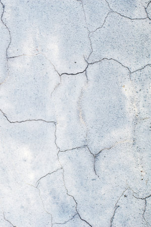 old cracked concrete background. a gray concrete wall closeupの写真素材