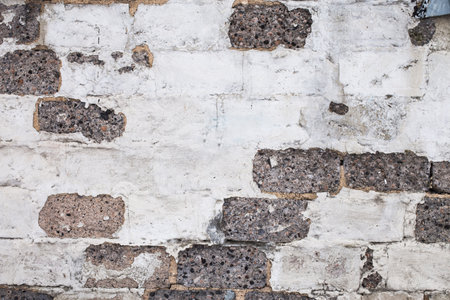 Old brick white gray color wall background. Light stone textureの写真素材