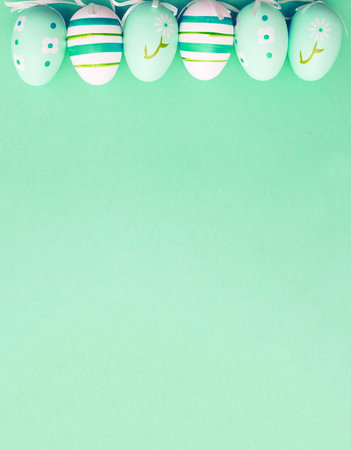 easter colorful handmade painted eggs on green background with copy space. bannerの写真素材