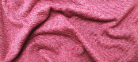 burgundy viva magenta wrinkled plush fabric background texture, soft material pattern.の写真素材