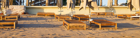 beach scene in Side Turkey with empty umbrellas and sun loungers. Vacation at the sea. Summer holidays. Bannerの写真素材
