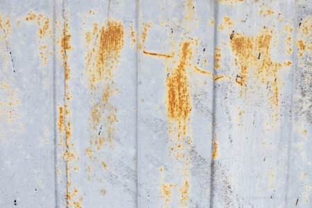 Rusty metal abstract background. Texture of an old blue grunge metal plate with cracked paint. Rusted w painted wall.の写真素材