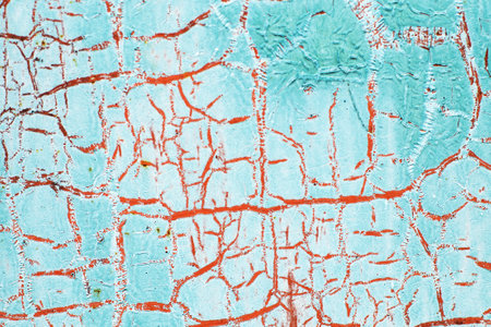 Rusty turquoise metal abstract background. Texture of an old blue grunge metal plate with cracked paint. Rusted white and browm painted wall.の写真素材
