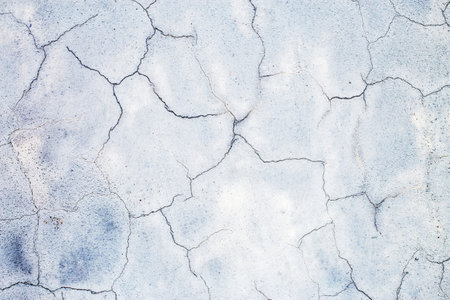 old cracked concrete background. a gray concrete wall closeupの写真素材