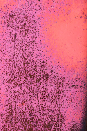 Pink, vinous, burgundy metal abstract background. Texture of an red old grunge metal plate with dripping stained cracked paint. Scratched rusted painted wall with brush strokes of paint.の写真素材